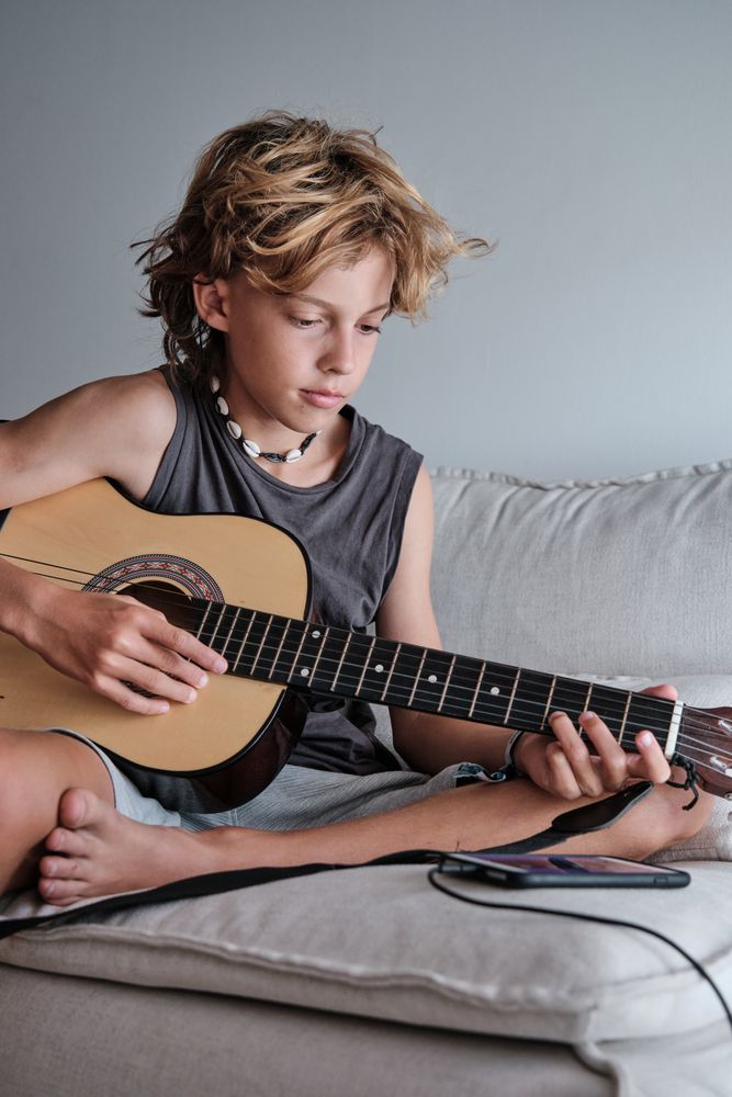 Child playing the guitar