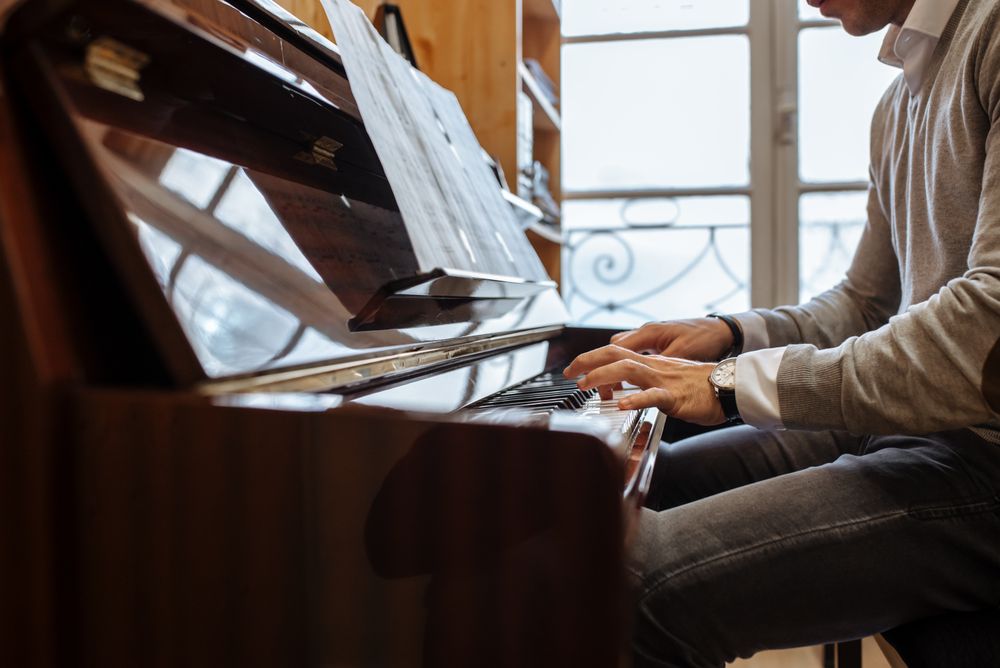 Man playing piano in studio