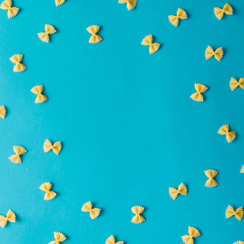 Pattern made of pasta on blue background