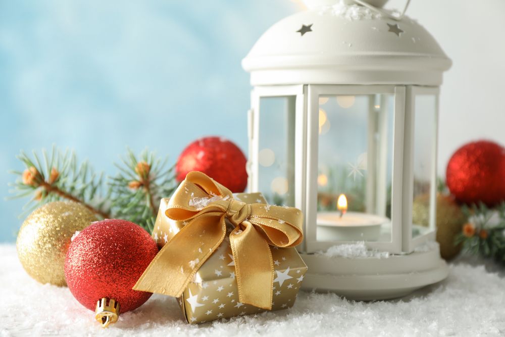 Christmas lantern on decorated background, space for text