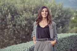 Joyful woman standing in countryside
