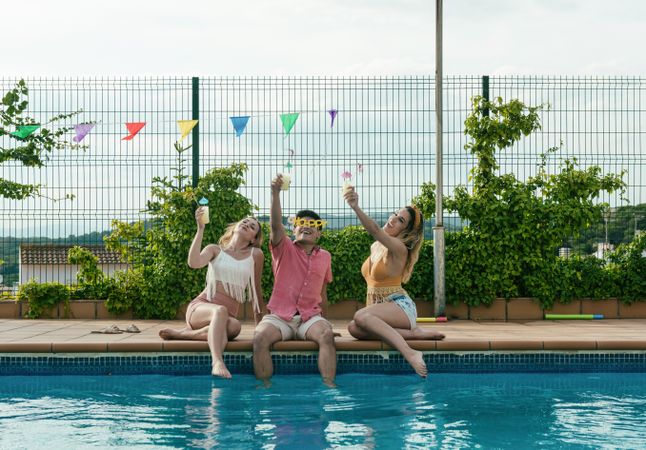 Group of friends having a pool party