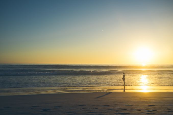 Woman near waving sea