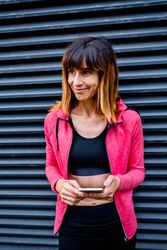 Female athlete with mobile phone