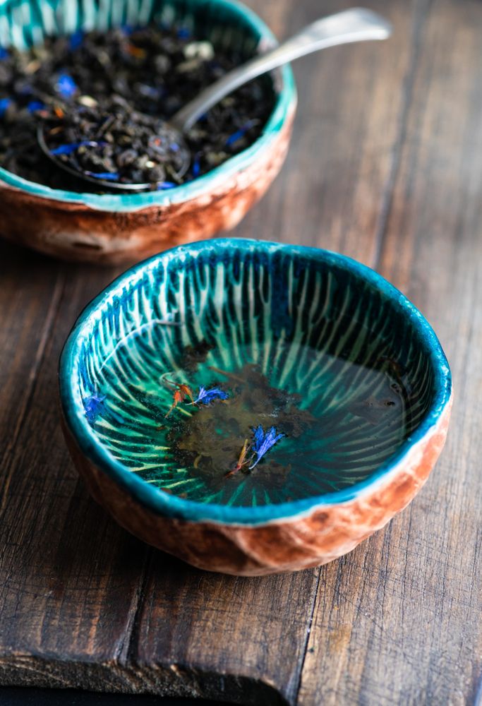 Loose leaf tea served in teal cup