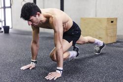 Man stretching in gym