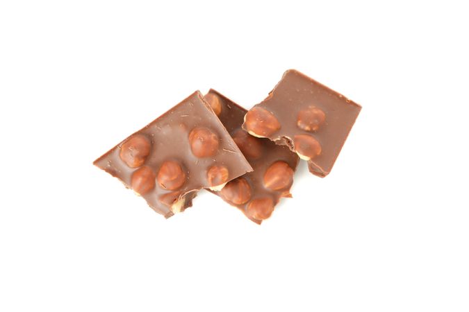 Tasty chocolate pieces isolated on plain background