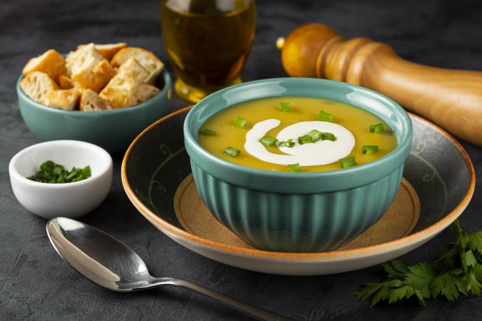 Bowl with pumpkin soup on the table.