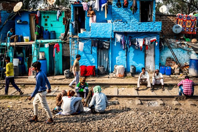 People gathering outdoor in a neighborhood in India