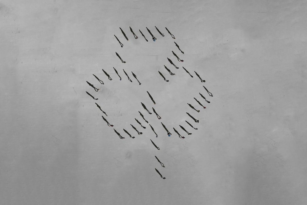 People seen from above forming a shamrock