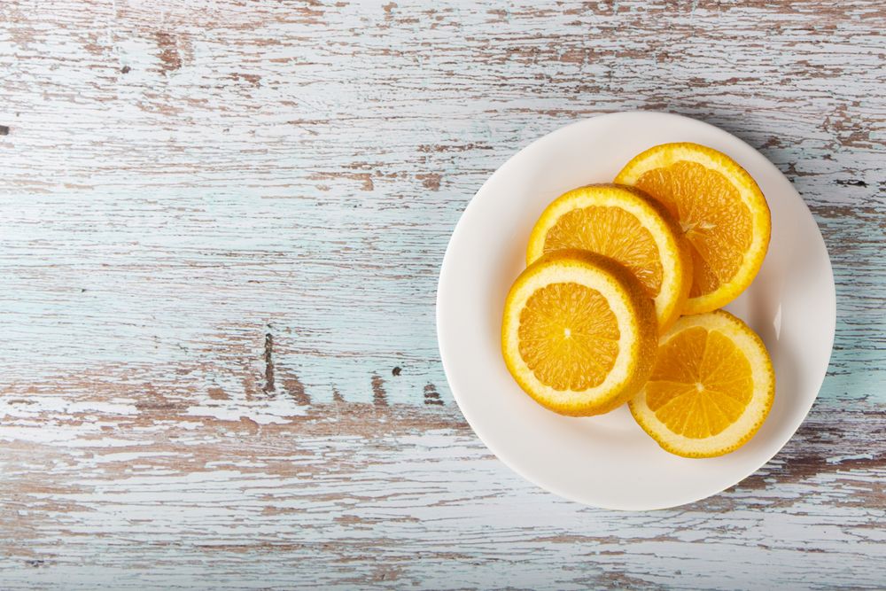 Sliced oranges on the table.