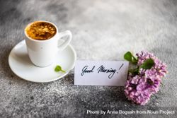 Cup of espresso and lilacs on grey counter with Good Morning note 5qkqYJ