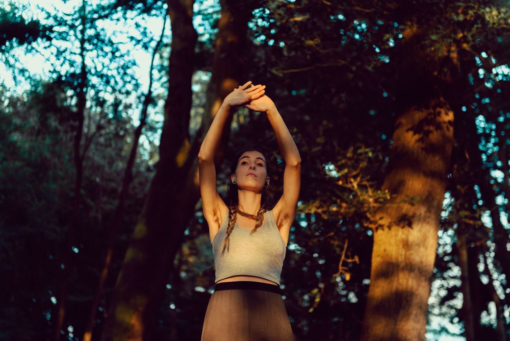 Young woman in majestic forest