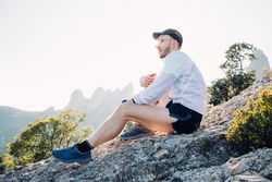 Male athlete stretching after training