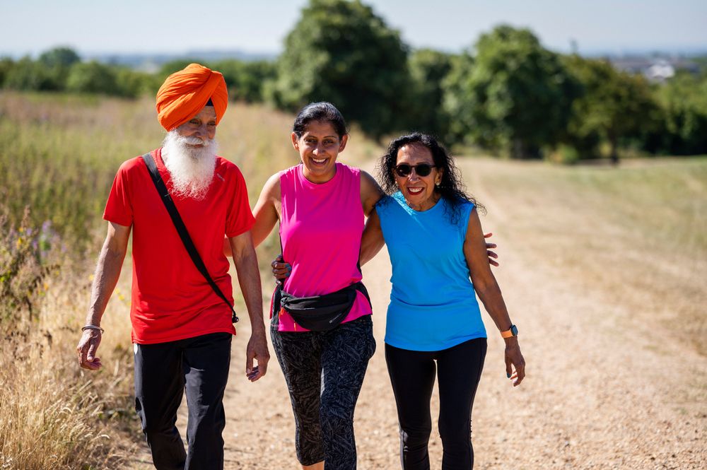 Mature Sikh family going for stroll in park