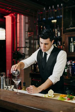 Barman working making drinks