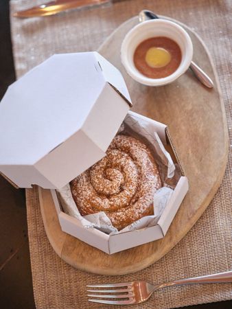 Delicious pastry on board on napkin