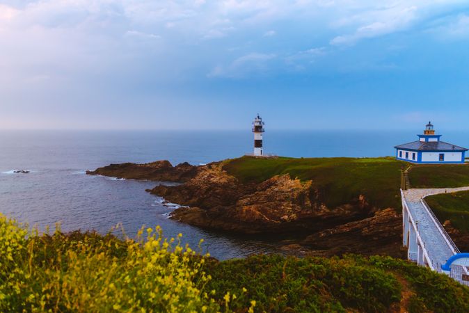 Amazing lighthouse on cliff near sea