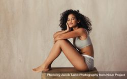 Black female model posing confidently in her natural body 49PGv5
