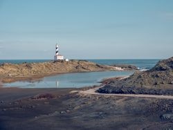 Picturesque scenery of lighthouse located near ocean