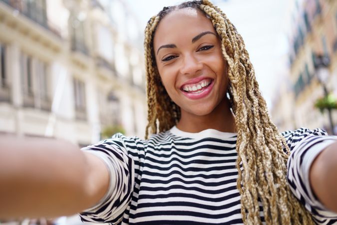 POV view of happy woman taking selfie