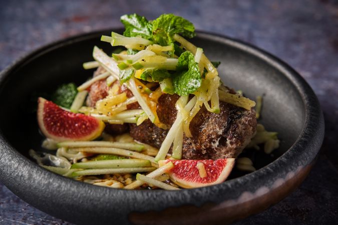 Tasty pig trotter with salad served in plate