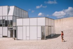 Woman next to contemporary building