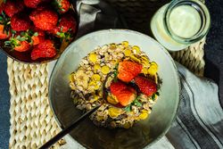 Healthy breakfast of oatmeal and strawberry with milk