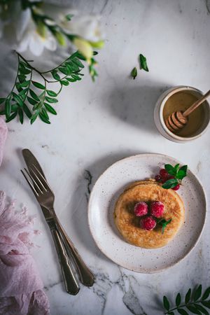 Pancake with fresh raspberry on plate