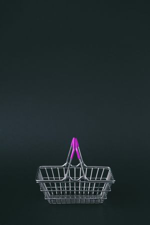 Shopping basket on dark background