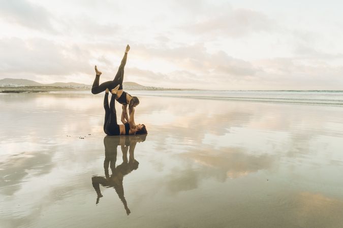 Women exercising near sea