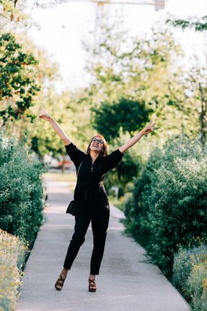 Cheerful female walking in park