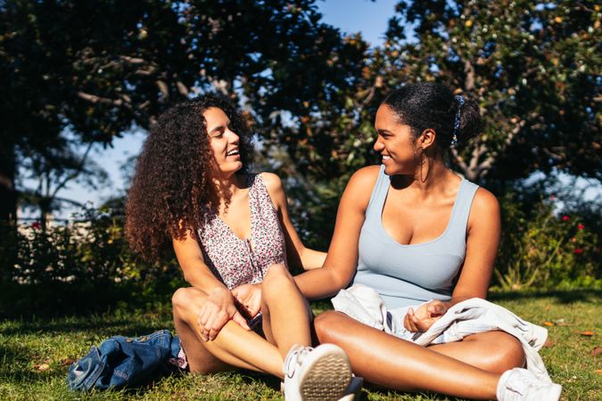 Girlfriends talking and enjoying in a park