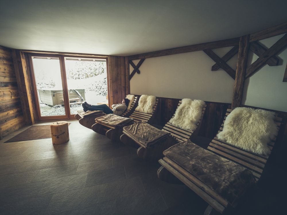 Female relaxing on rocking lounge chair