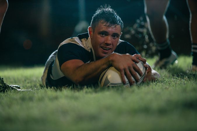 Rugby player making a touch down during the match