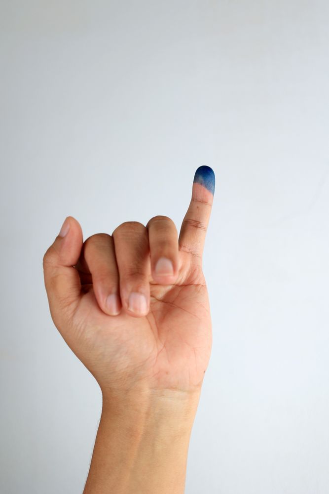 Close Up of Hand Gesture Little Finger After Voting.