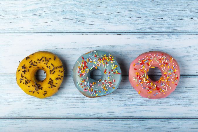 Delicious assorted colorful donuts on the table.