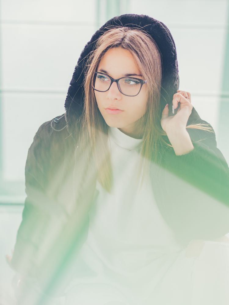 Young woman over a glasses ground