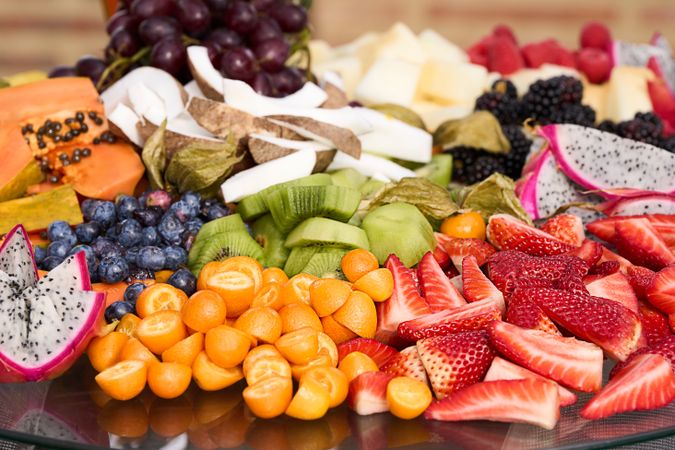 assorted fruits strawberries kiwi grape coconut coconut berries pumpkin dragon fruit