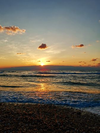 Seascape. Sunset on coast.