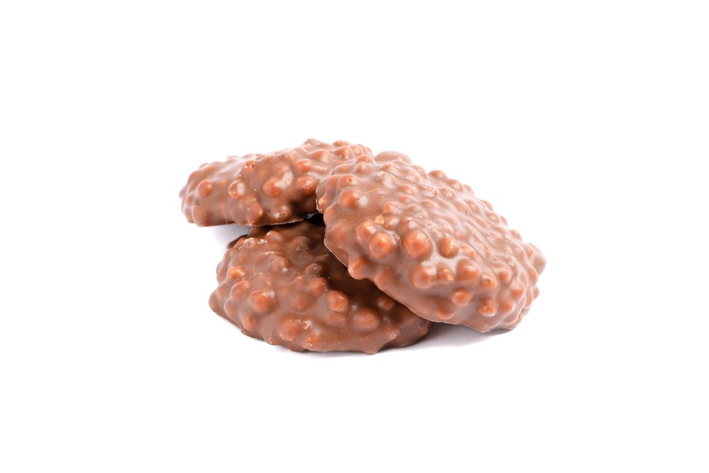 Chocolate cookies with caramel filling isolated on studio background