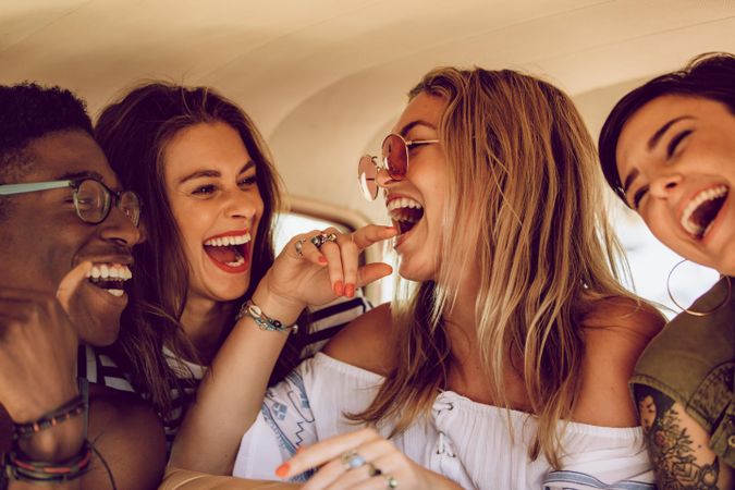 Group of woman and women having fun on a road trip