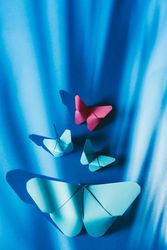 Paper butterflies on silk cloth