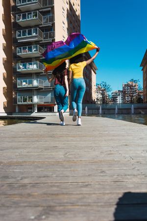 Two woman with rainbow flag