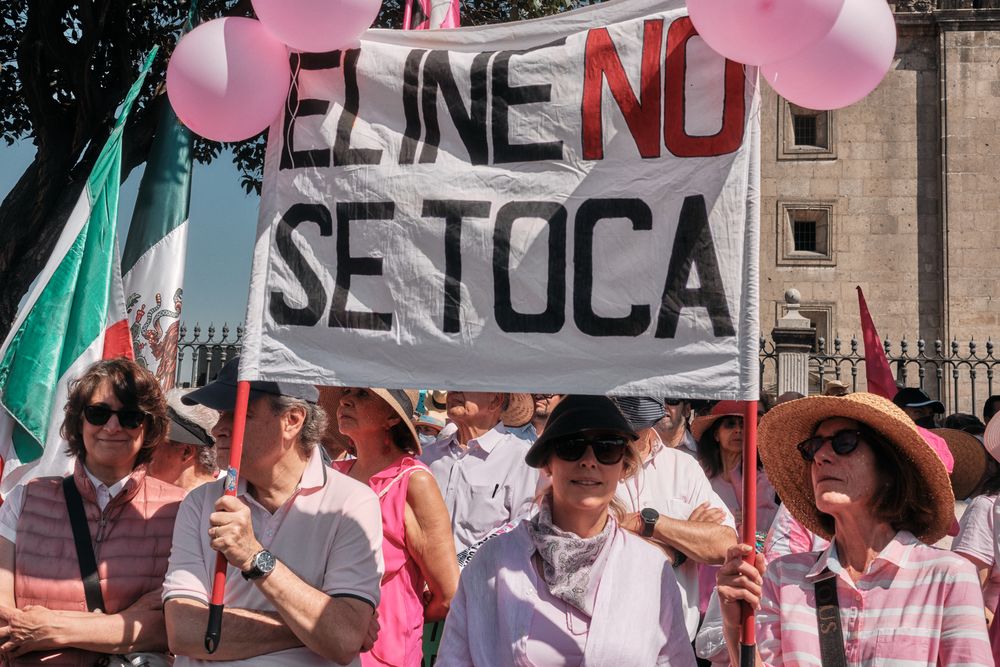 Mexico City, Mexico - February 26th, 2022: Women and men holding sign at election reform protest