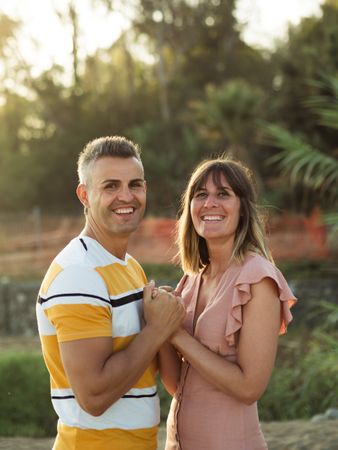 Happy couple looking at each other on beach