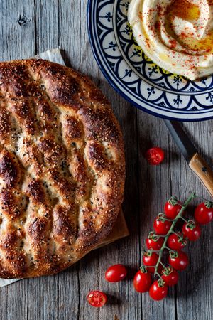 Ramazan pidesi near spices and tomatoes