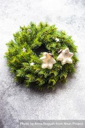 Christmas wreath with decorative stars on marble background, vertical composition bxWPy4