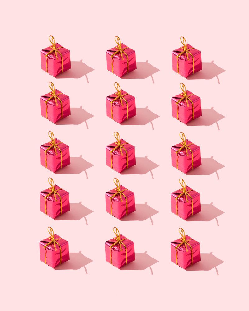 Red presents over pink background