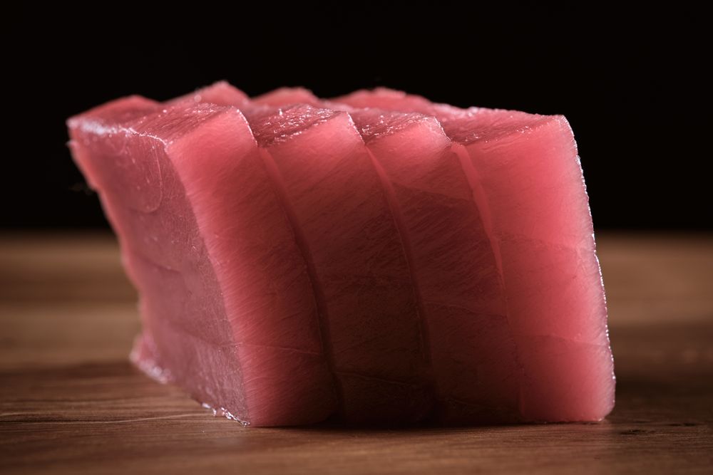 Fresh raw tuna on kitchen table